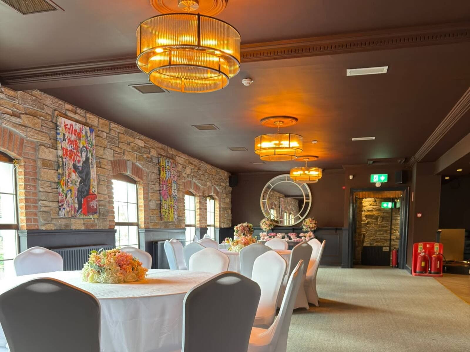 The Function Room at Fitzpatrick's Baldoyle, with its exposed stone wall and tables dressed for a celebration