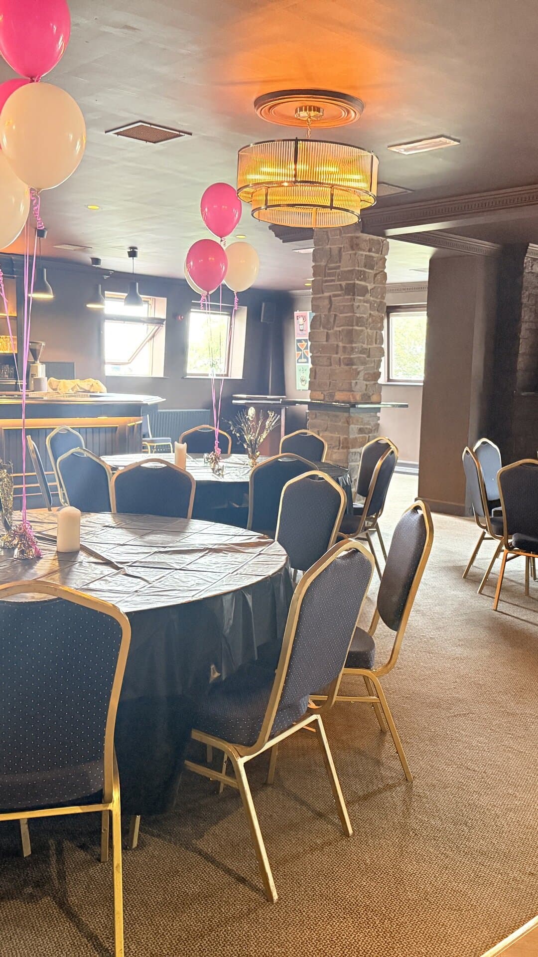 The Function Room dressed for a party, with balloons and tables set