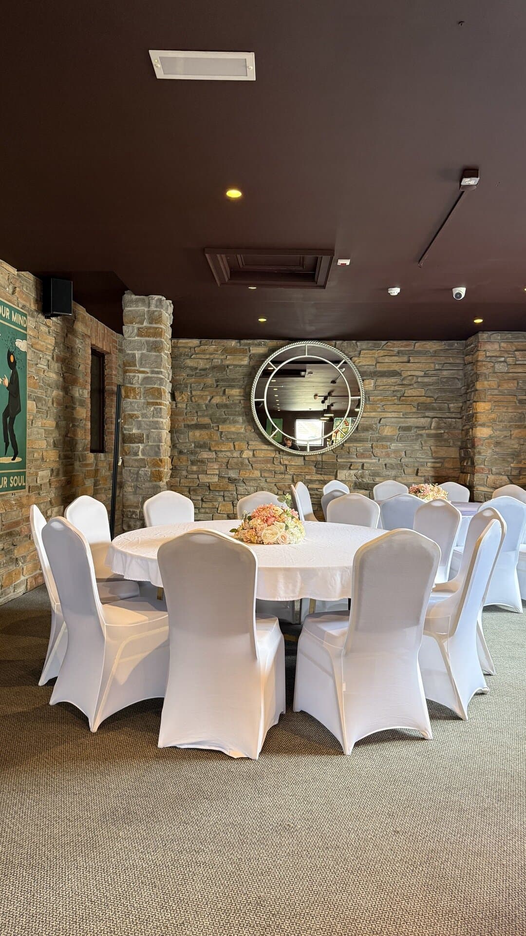 The Function Room set for a seated dinner, tables dressed in white