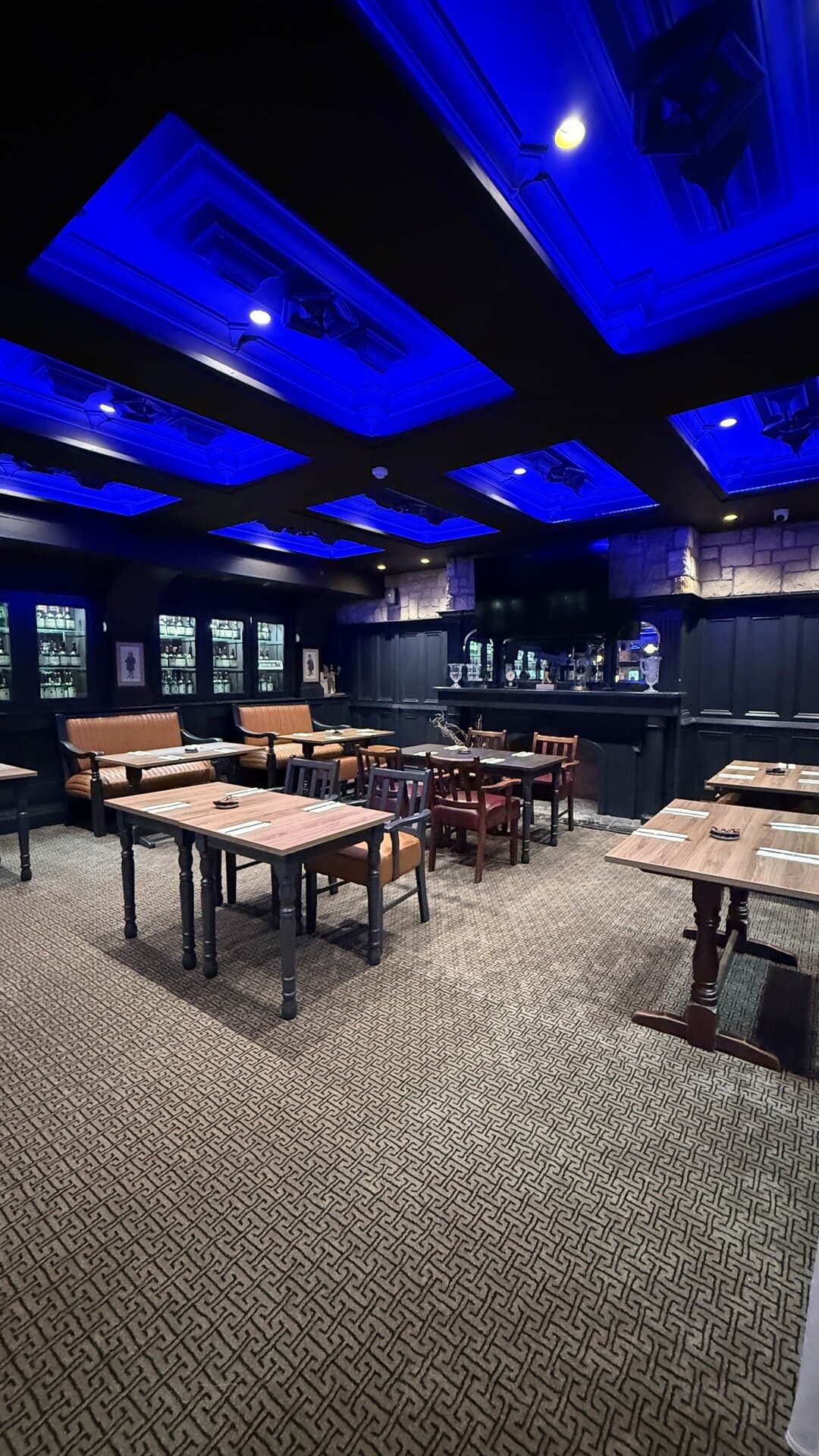The Library lit for an evening event, with its own bar and whiskey collection